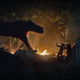 An Allosaurus stalks a very unfortunate family.